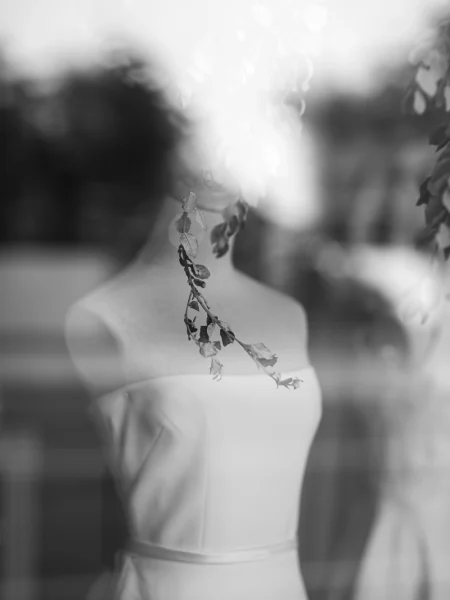 A mannequin wearing a strapless wedding dress.