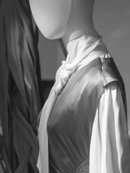 Cloth mannequin wearing a silk scarf.